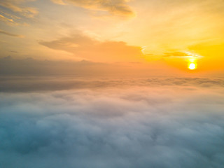 Aerial view above cloud with sunlight background.