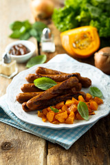 Grilled sausages with roasted pumpkin