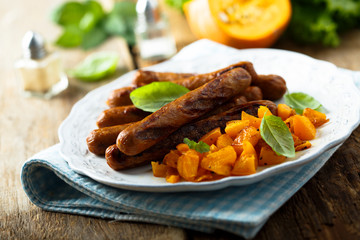 Grilled sausages with roasted pumpkin