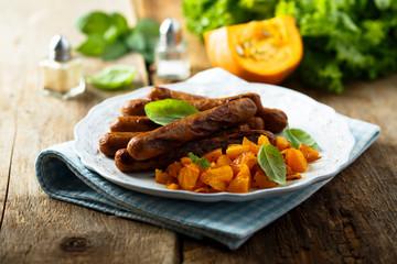 Grilled sausages with roasted pumpkin