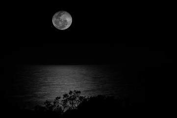 Moonrise over ocean, black and white, low key, Sunshine Coast, Queensland, Australia