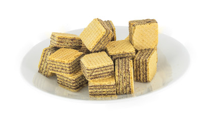 Chocolate wafer cubes on the plate isolated white background