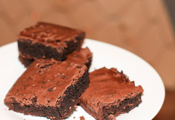 fresh flavored chocolate brownies on a white plate