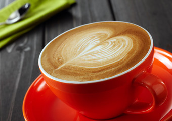 Delicious coffee drink on wooden tabletop
