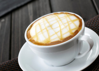 Delicious coffee drink on wooden tabletop
