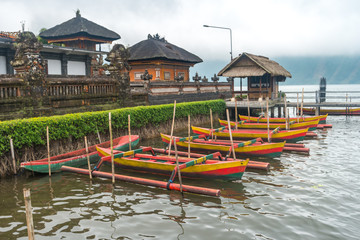 Traditional wooden boat with cloudy skies.