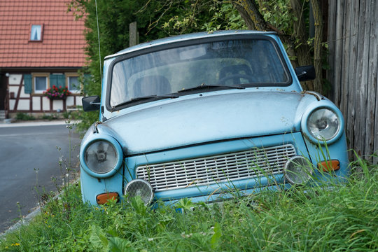 Old Eastern Europe GDR car is in the green meadow