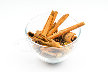 Cup of cinnamon with white background.