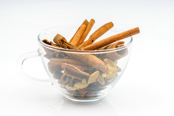 Cup of cinnamon with white background.