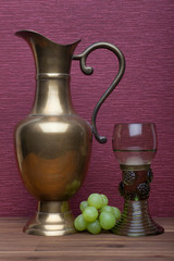 Renaissance, rummer wine glass and bottle with green grapes