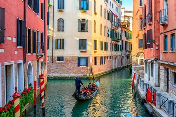 Peel and stick wall murals Gondolas Narrow canal with gondola and bridge in Venice, Italy. Architecture and landmark of Venice. Cozy cityscape of Venice.