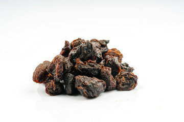 Dry longan fruit with white background.