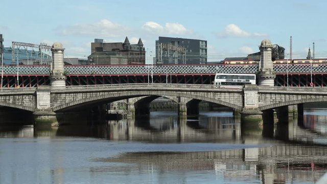 Train and traffic cross River Clyde, King George V bridge, Glasgow, Scotland