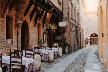 Cozy street with old houses in Ferrara, Emilia-Romagna, Italy. Ferrara is capital of the Province of Ferrara.