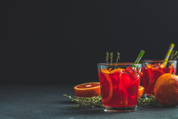 Campari traditional Italian alcoholic liqueur on black concrete background