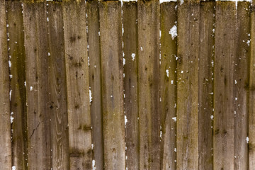 old wooden fence in the snow