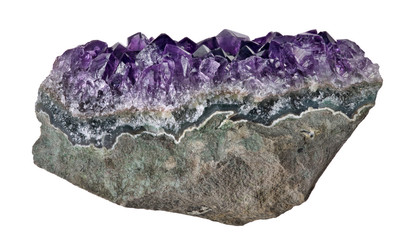 dark deep color amethyst in stone on white