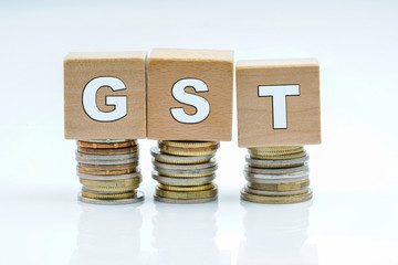 Coins and wooden with tax GST.