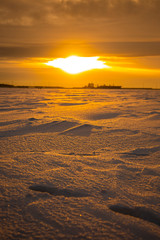 Fototapeta na wymiar Sunset on the Neva Bay in winter