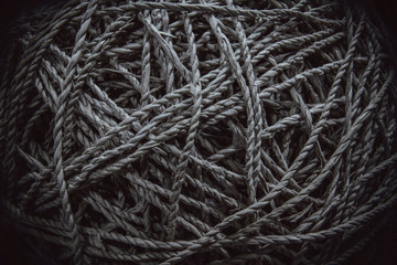 A roll of natural fibre ropes monochrome