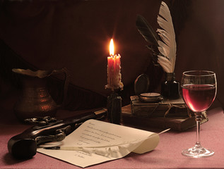 Still-life with an old pistol, wine and a burning candle