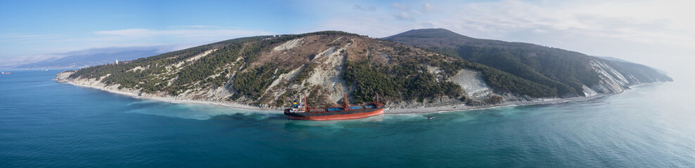 GELENDZHIK, RUSSIA - JAN 19, 2018: The ship called Rio ran aground after a storm in the black sea. Aerial view.