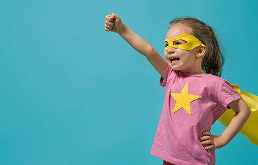 child playing superhero