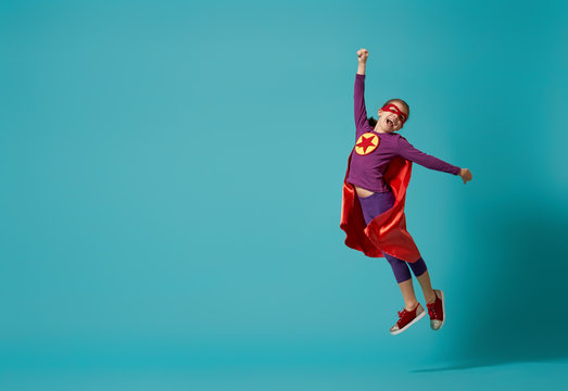 child playing superhero