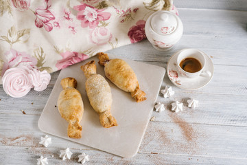 Strudel dessert on the white wooden baclground