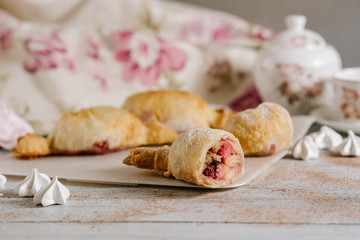 Strudel dessert on the white wooden baclground