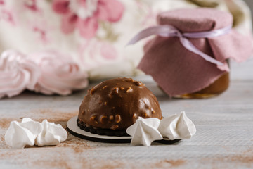 Sweet dessert candies on white wooden background