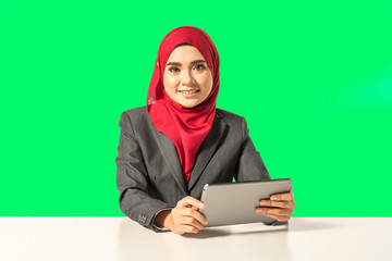 Businesswoman looking the tablet with muslimah lifestyle.