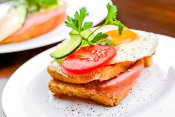 Breakfast - fried egg with bacon and cheese