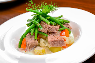 Hot salad with meat, vegetables and beans