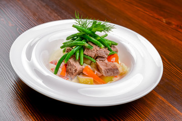 Hot salad with meat, vegetables and beans