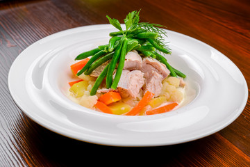 Hot salad with meat, vegetables and beans