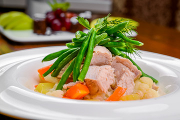 Hot salad with meat, vegetables and beans