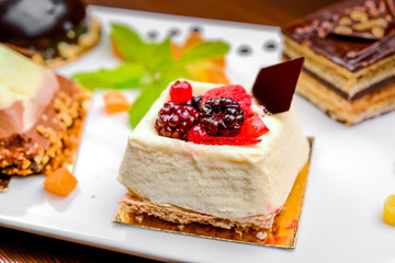 An assortment of white, dark, and milk chocolate with nuts, muffins, macaroons