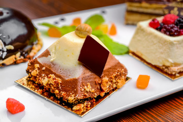 An assortment of white, dark, and milk chocolate with nuts, muffins, macaroons