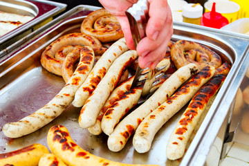 Closeup shot of sausages on the metal tray