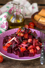 Salad with boiled beetroot, fresh tomato and marinated shallot