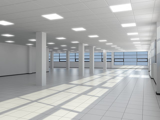Empty office with white columns and large windows