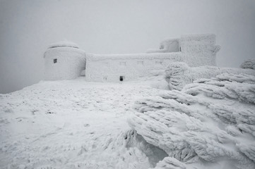 snov-covered abandoned observatory