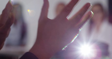 4k, Team of business people listening keenly to a presentation with closeup of hands. Slow motion.