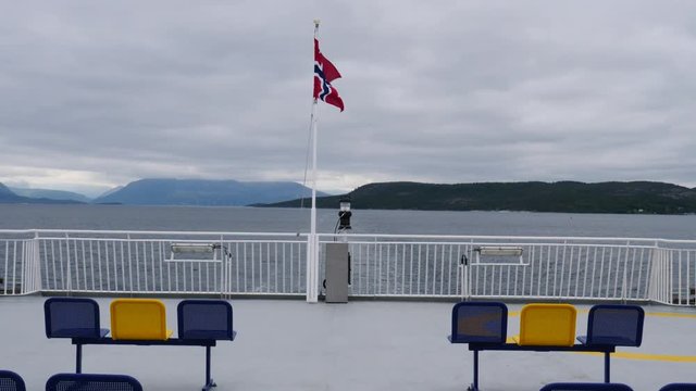 Ferry deck with empty seats and sea view in the background. Ferryboat ride route Bognes - Lodingen to Lofoten islands Norway. Tourism vacation and travel