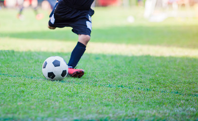 Kid soccer player do penalty shootout