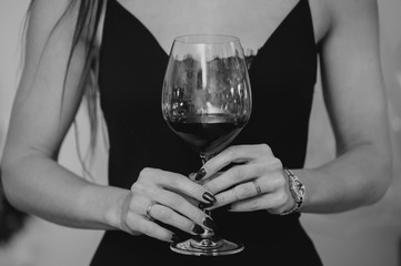 Close up hands of woman with wine glass
