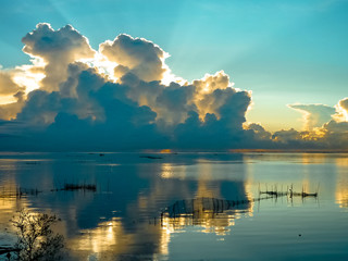 Naklejka na ściany i meble Beautiful sunset at the Chilika Lake, Odisha stated India with clouds and blue sky.