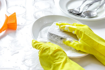 concept of woman washing dishes on white background