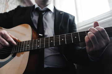 Fototapeta premium Young man playing the guitar.